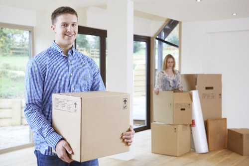 Professional movers handling furniture for a small removal in Enfield