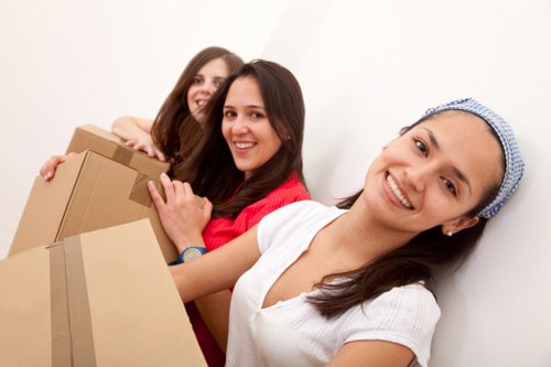 Professional movers handling furniture in Enfield