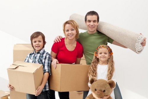 Family packing belongings into a portable storage unit