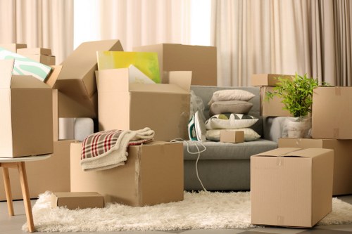 Professional movers packing household items in Enfield