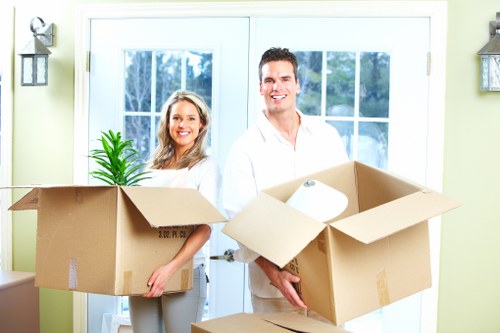 Moving day scene with boxes outside a home